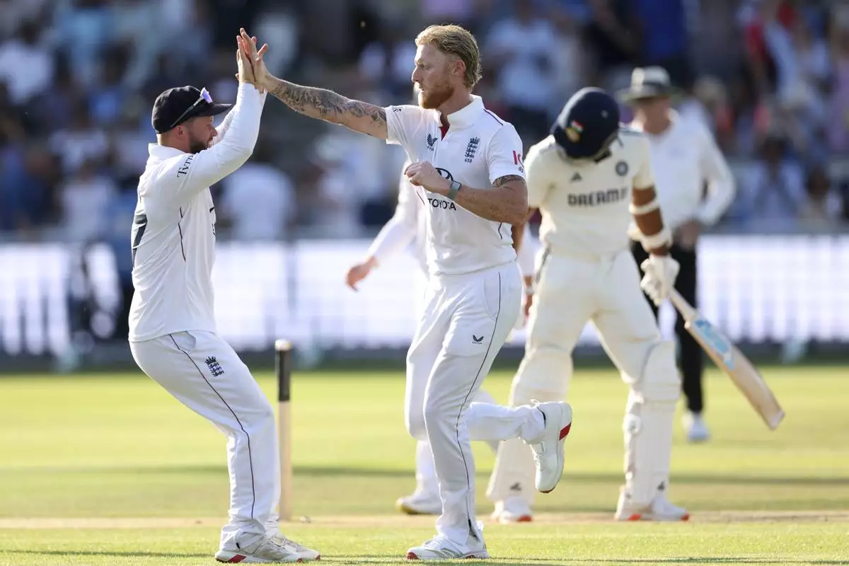 England's captain Ben Stokes, right, celebrates with teammates after the dismissal of the dismissal of India's Akash Deep during the fourth day of the third cricket test match between England and India at Lord's cricket ground in London, Sunday, July 13, 2025.(AP Photo/Richard Pelham)