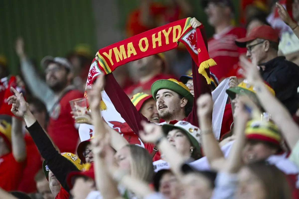 Fans of Wales sing prior the Euro 2025, group D, soccer match between France and Wales at Arena St. Gallen in St. Gallen, Switzerland, Wednesday, July 9, 2025