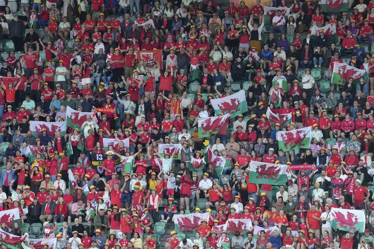 Fans of Wales cheer prior the Euro 2025, group D, soccer match between France and Wales at Arena St. Gallen in St. Gallen, Switzerland, Wednesday, July 9, 2025. (AP Photo/Martin Meissner)