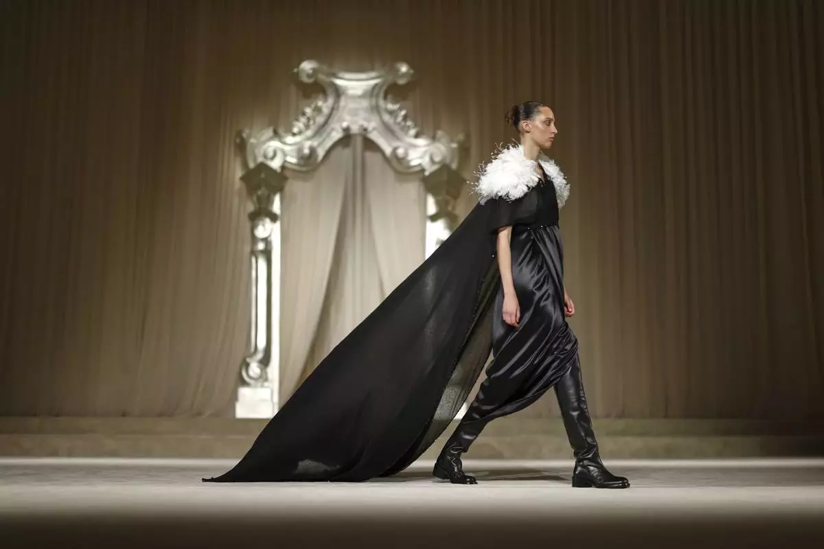 A model wears a creation as part of the Chanel Fall-Winter 2025/26 Haute Couture collection presented Tuesday, July 8, 2025, in Paris. (AP Photo/Tom Nicholson)