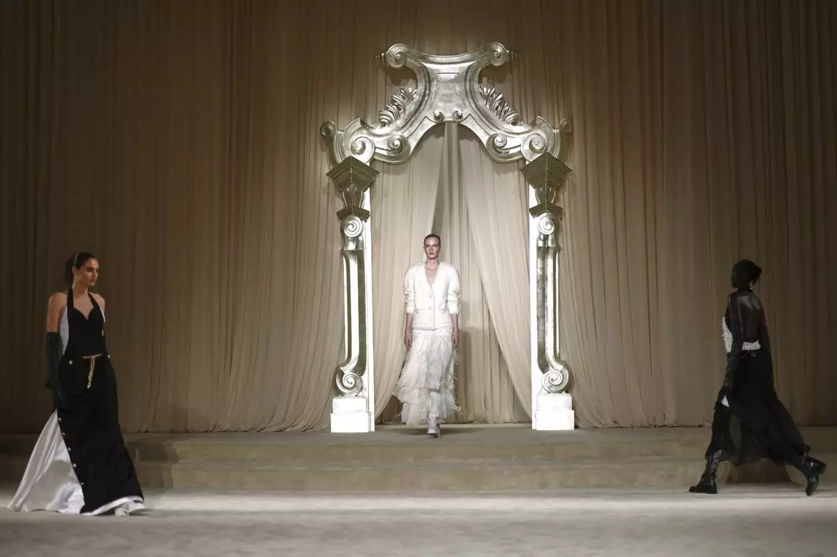 Models wear creations as part of the Chanel Fall-Winter 2025/26 Haute Couture collection presented Tuesday, July 8, 2025, in Paris. (AP Photo/Tom Nicholson)