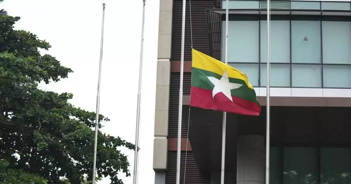 Myanmar's military leader puts in rare appearance at event honoring Aung San Suu Kyi's father