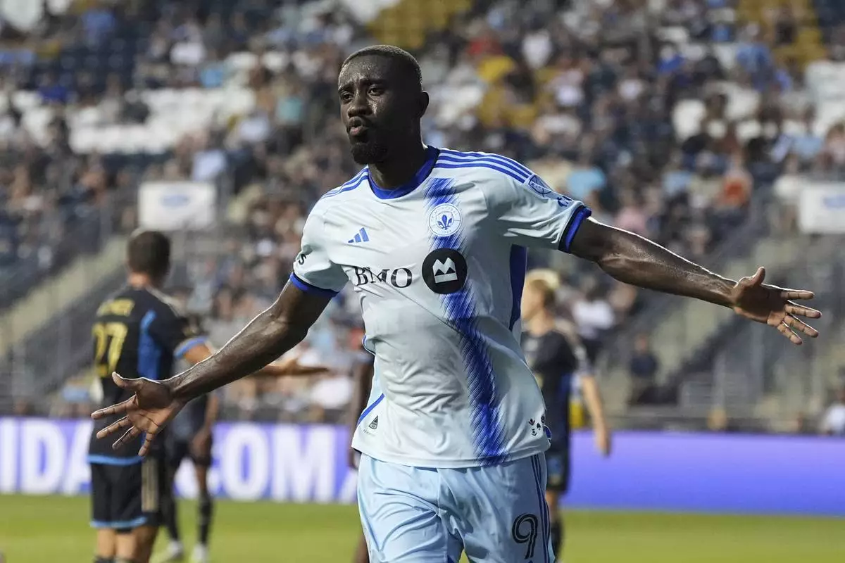 CORRECTS TEAM NAME TO CF MONTREAL NOT TORONTO FC - CF Montreal 's Prince Owusu reacts after scoring a goal during the first half of an MLS soccer match against the Philadelphia Union, Wednesday, July 16, 2025, in Chester, Pa. (AP Photo/Matt Slocum)