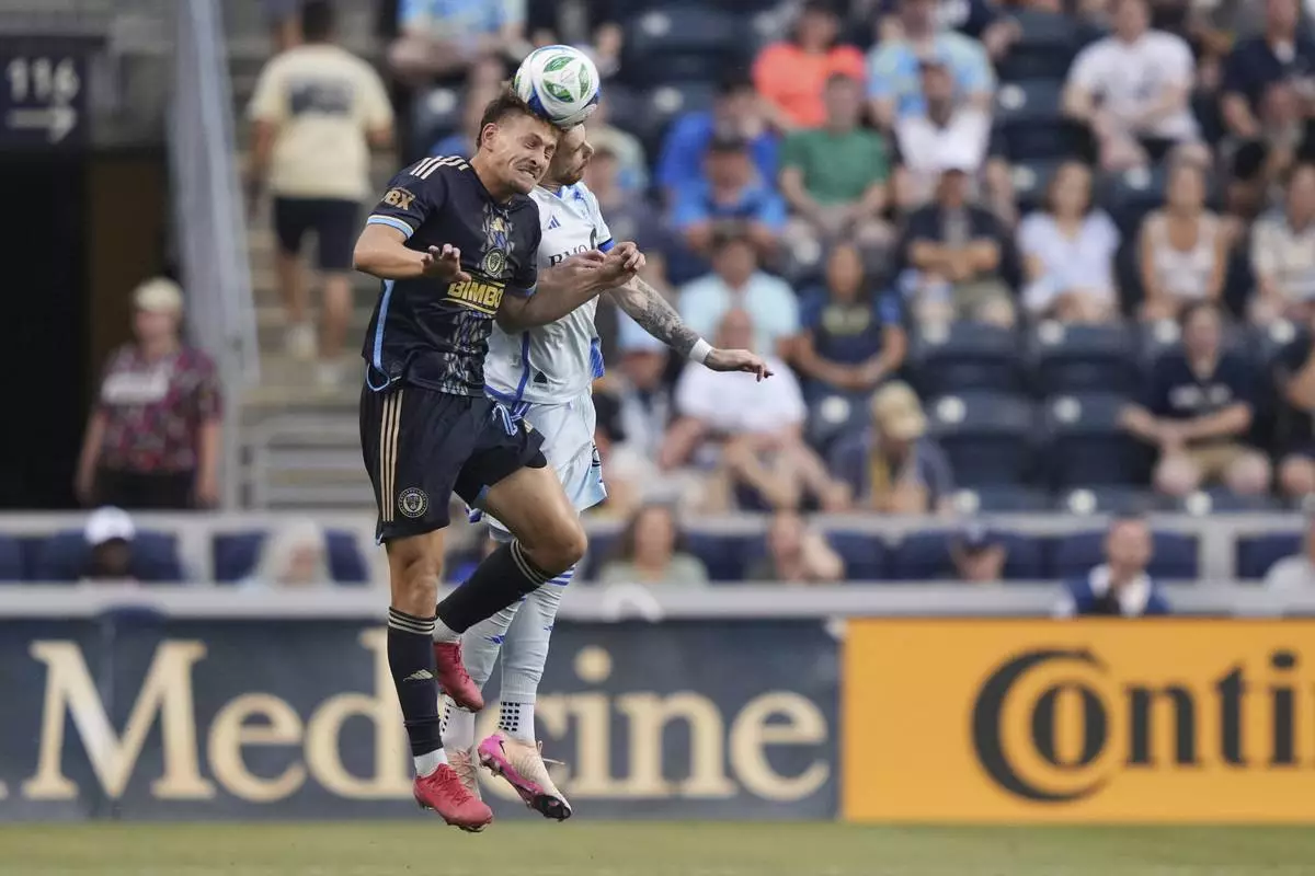 CORRECTS PLAYER'S NAME TO JOEL WATERMAN NOT TYRESE SPICER AND TEAM TO CF MONTREAL NOT TORONTO FC - Philadelphia Union's Bruno Damiani, left, and CF Montreal's Joel Waterman leap for the ball during the first half of an MLS soccer match, Wednesday, July 16, 2025, in Chester, Pa. (AP Photo/Matt Slocum)