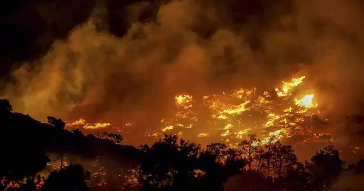 Wildfire on Greek island of Crete prompts evacuations of hotels and damages homes