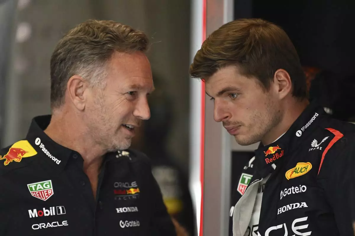 FILE -Red Bull team principal Christian Horner talkks to Red Bull driver Max Verstappen of the Netherlands before the third free practice at the Red Bull Ring racetrack, ahead of the Austrian Formula One Grand Prix in Spielberg, Austria, Saturday, June 28, 2025. (AP Photo/Denes Erdos), File)