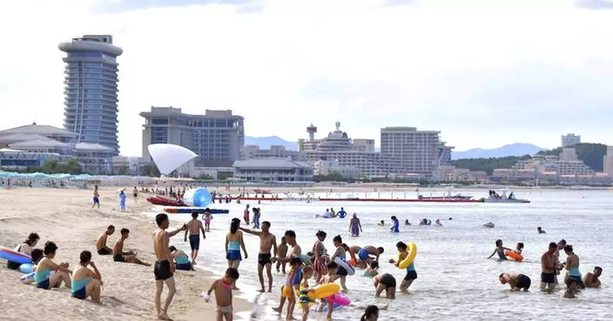 North Koreans swim and play at a beach resort touted as a boost for tourism