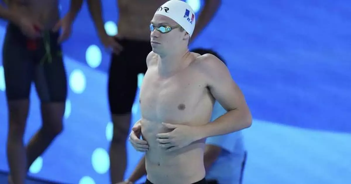 Léon Marchand breaks world record in 200 individual medley in 1 minute, 52.69 seconds