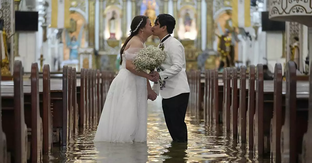 Photos show a Filipino couple walking down a flooded aisle on their wedding day