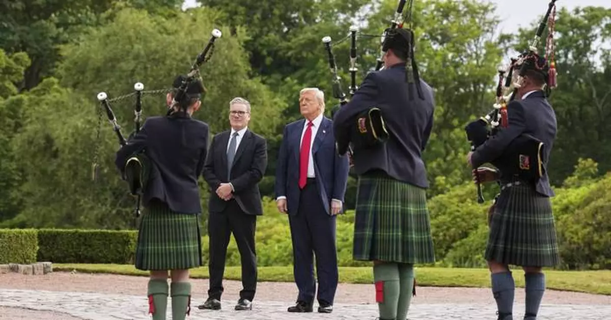 Trump caps his Scottish visit by opening a new golf course and promoting his family brand