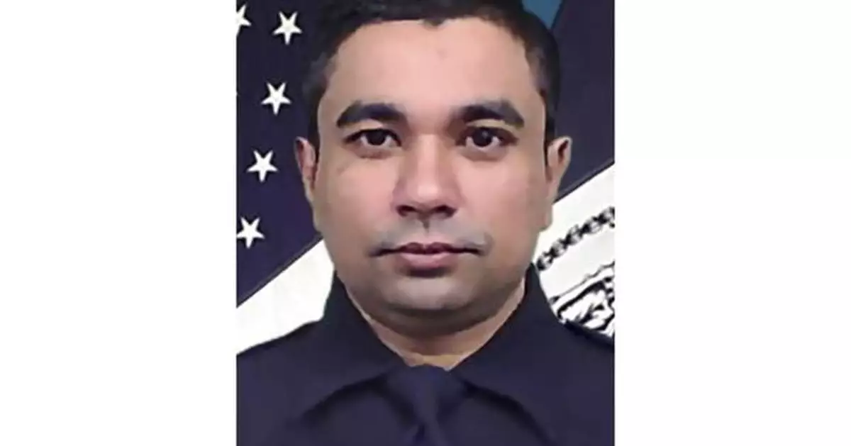 Mourners honor the NYPD officer killed in the attack at the NFL headquarters building