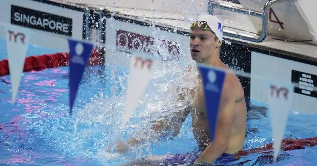 Léon Marchand might be French but he led a Texas-flavored moment at the swim worlds
