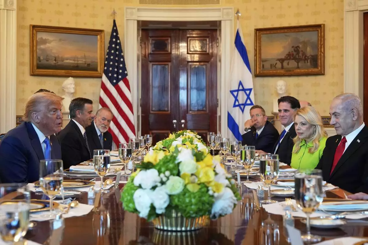 President Donald Trump, left, meets with Israel's Prime Minister Benjamin Netanyahu, right, in the Blue Room of the White House, Monday, July 7, 2025, in Washington. (AP Photo/Alex Brandon)