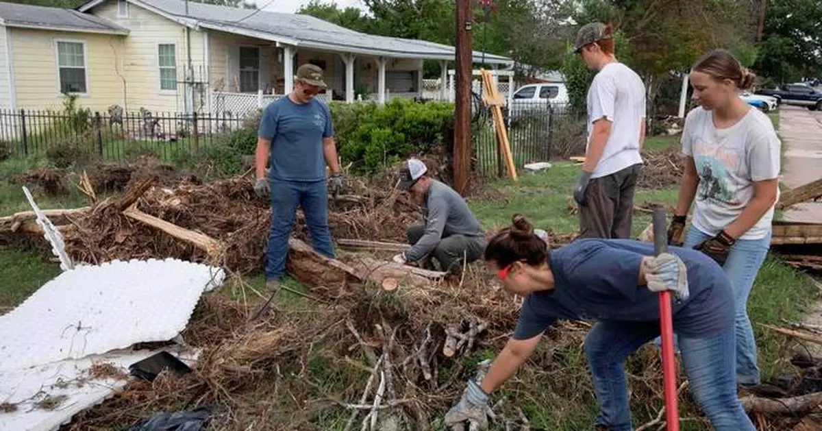 Armies of Texas volunteers dig out, clean up, after fatal floods
