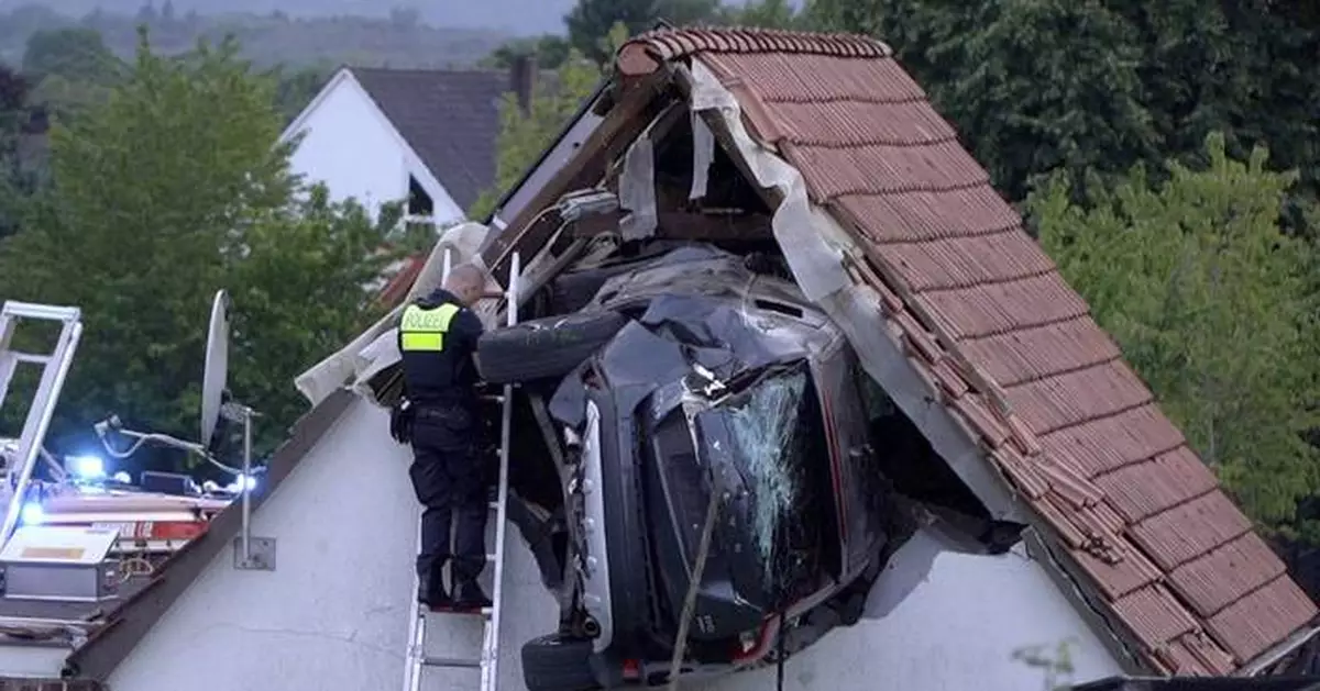 Car crashes into a barn's roof in Germany, seriously injuring 2