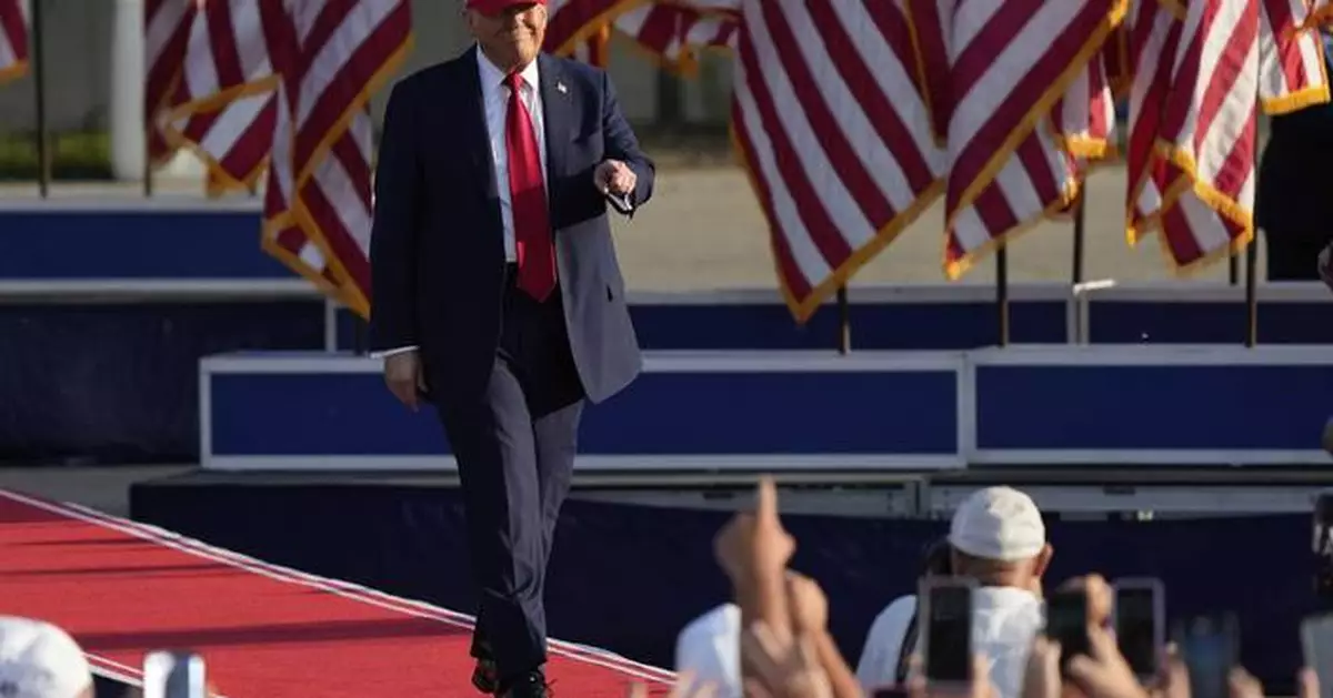 Trump signs his tax and spending cut bill at the White House July 4 picnic