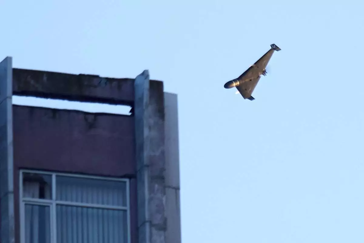 A Russian drone attacks a building during Russia's massive missile and drone air attack in Kyiv, Ukraine, Tuesday, June 17, 2025. (AP Photo/Efrem Lukatsky)