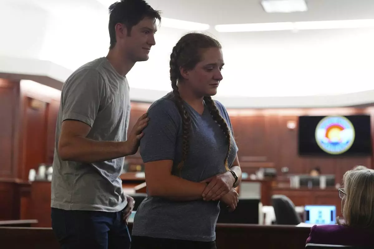 CORRECTS MIRIAM MESERVY'S LAST NAME - Miriam Meservy, right, returns to her seat after making a statement after her father, dentist James Craig, had a verdict rendered in his murder trial in district court in Arapahoe County Wednesday, July 30, 2025, in Centennial, Colo. (AP Photo/David Zalubowski, Pool)
