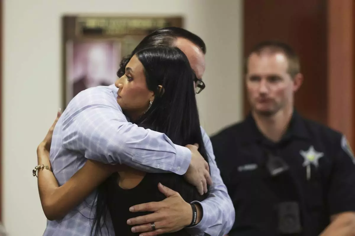 CORRECTS SPELLING OF ALIVEA - Steve Goncalves, father of victim Kaylee Goncalves hugs his daughter Alivea after speaking at the sentencing hearing of Bryan Kohberger at the Ada County Courthouse, Wednesday, July 23, 2025, in Boise, Idaho, for brutally stabbing four University of Idaho students to death nearly three years ago. (AP Photo/Kyle Green, Pool)
