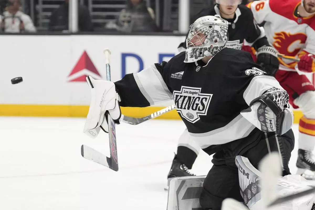 FILE - Los Angeles Kings goaltender David Rittich deflects a shot during the third period of an NHL hockey game against the Calgary Flames, April 17, 2025, in Los Angeles. (AP Photo/Mark J. Terrill, File)