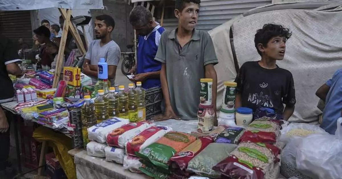 Gangs and merchants sell food aid in Gaza, where Israel’s offensive has shattered security