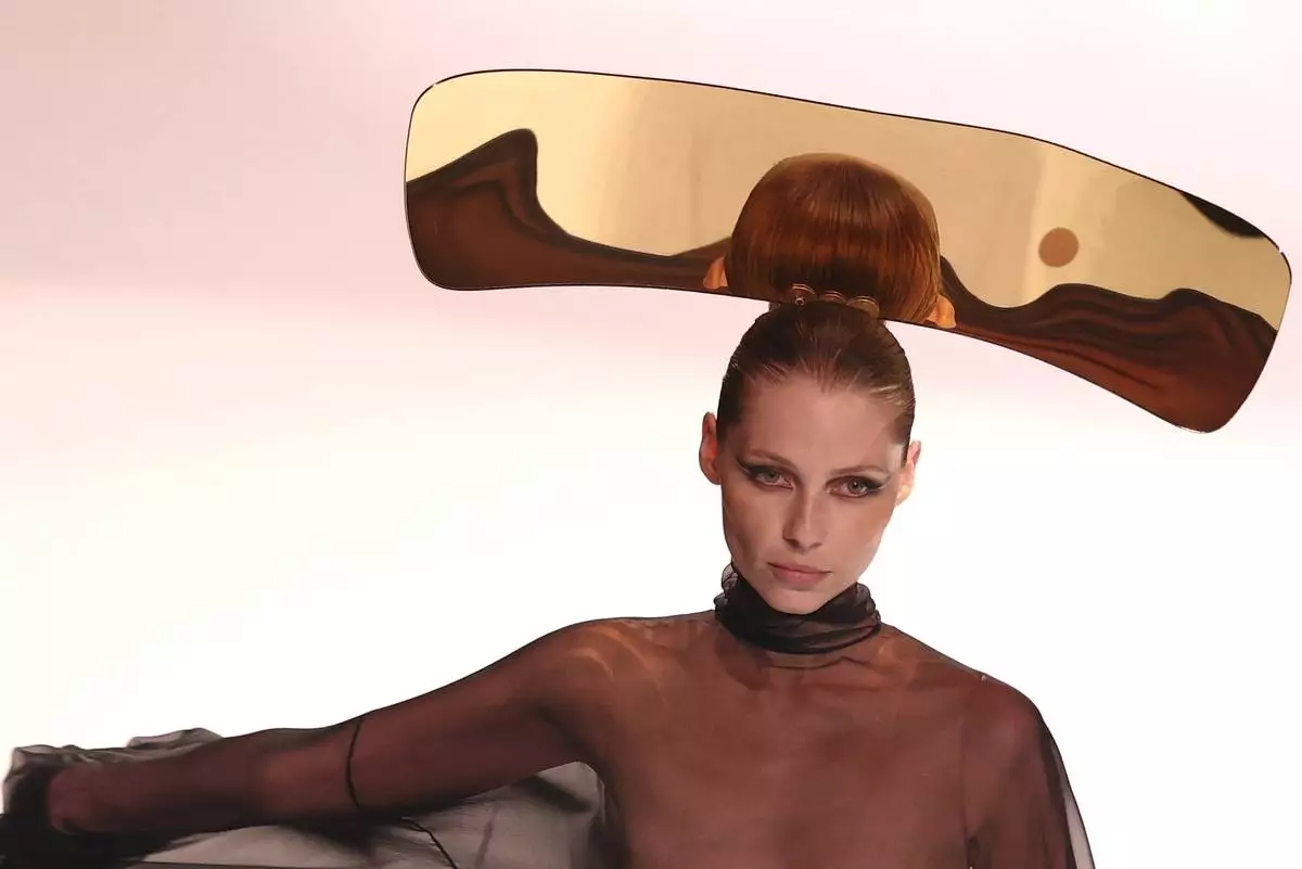 A model wears a creation as part of the Stephane Rolland Fall-Winter 2025/26 Haute Couture collection presented Tuesday, July 8, 2025, in Paris. (AP Photo/Tom Nicholson)