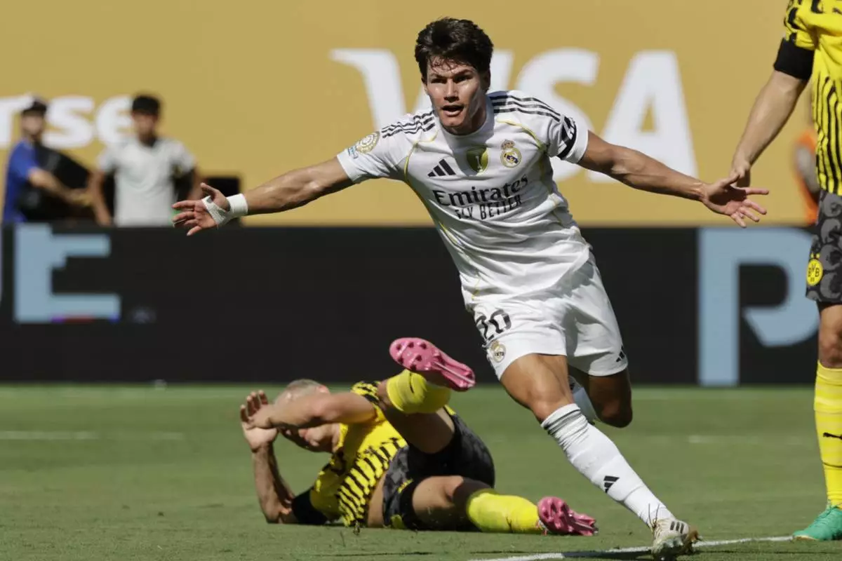 Real Madrid's Fran Garcia celebrates after scoring his side's second goal against Borussia Dortmund during the Club World Cup quarterfinal soccer match between Real Madrid and Borussia Dortmund in East Rutherford, N.J., Saturday, July 5, 2025. (AP Photo/Adam Hunger)