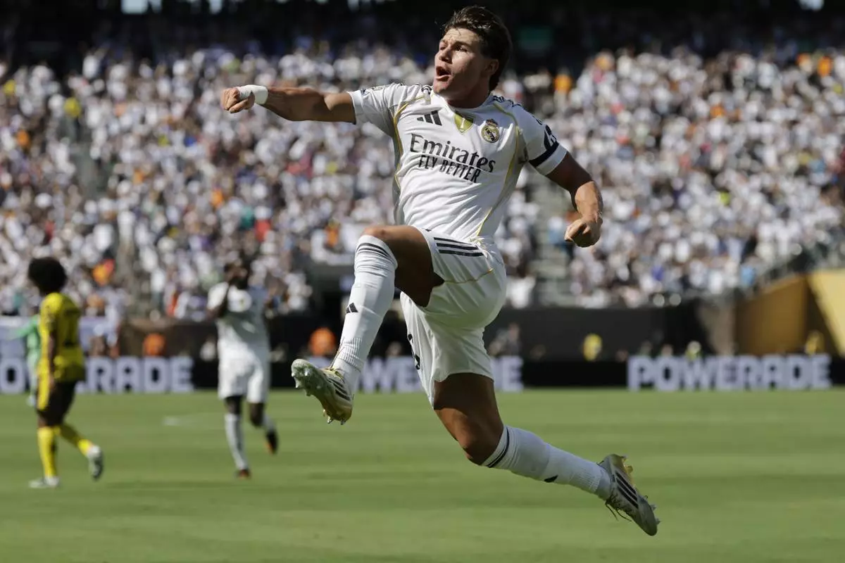 Real Madrid's Fran Garcia celebrates after scoring his side's second goal against Borussia Dortmund during the Club World Cup quarterfinal soccer match between Real Madrid and Borussia Dortmund in East Rutherford, N.J., Saturday, July 5, 2025. (AP Photo/Adam Hunger)