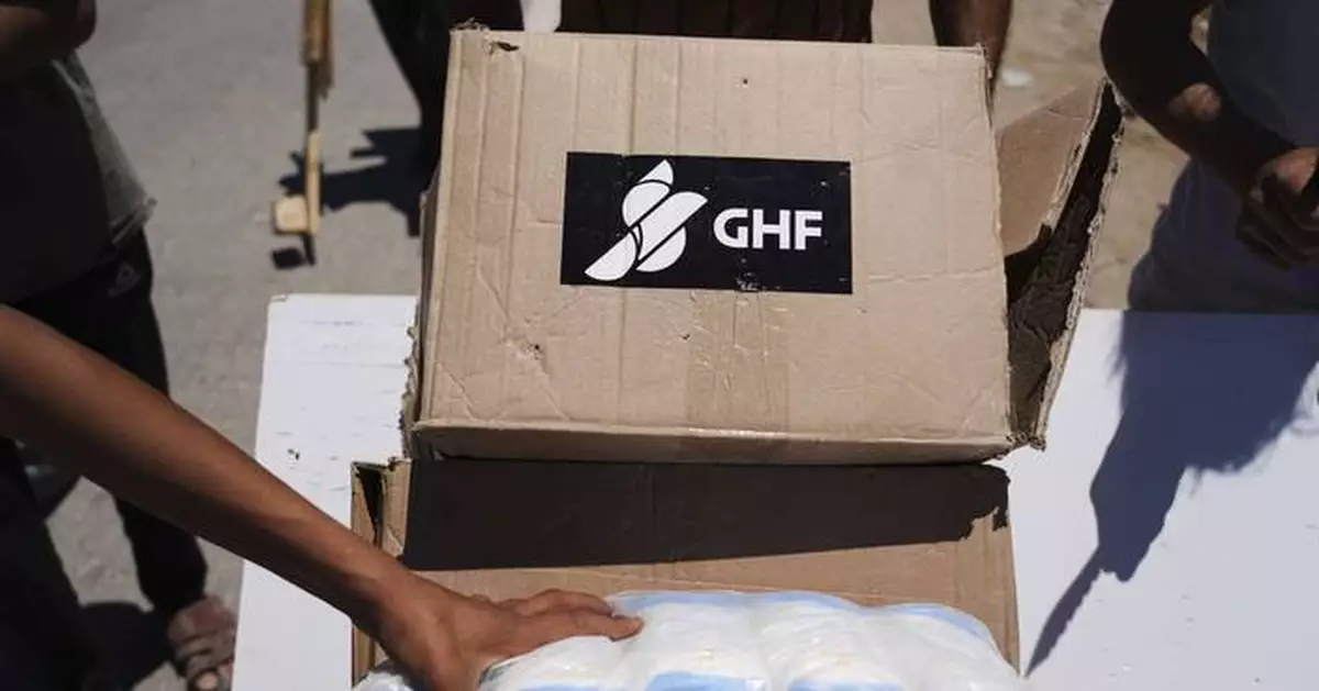 A crowd surge at an aid site in Gaza run by an Israeli-backed group kills 20 Palestinians