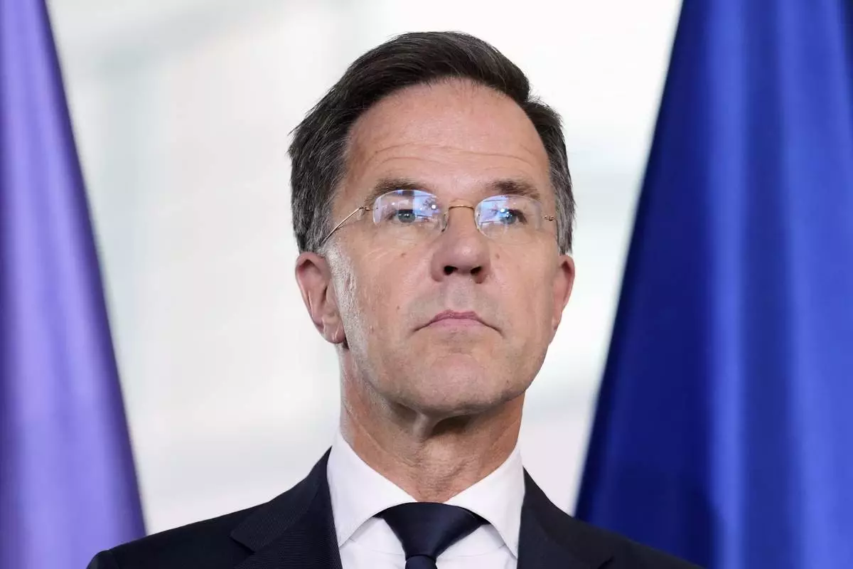 NATO Secretary General Mark Rutte attends a news conference with German Chancellor Friedrich Merz during a meeting at the chancellery in Berlin, Germany, Wednesday, July 9, 2025. (AP Photo/Markus Schreiber)