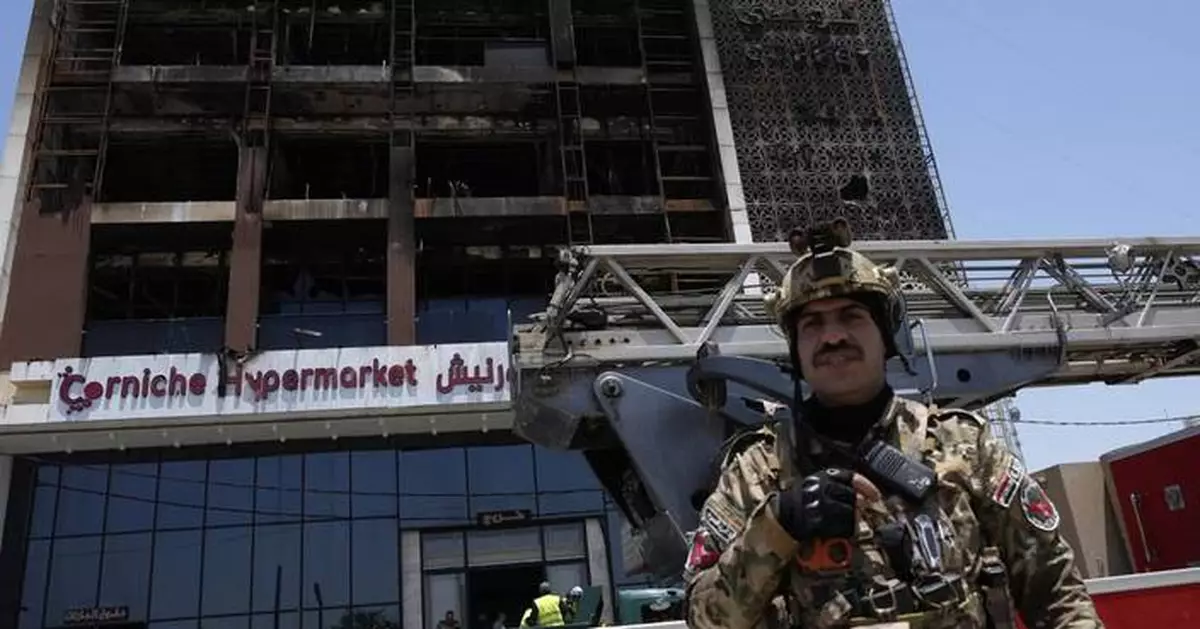 Officials try to identify 18 bodies in deadly Iraq shopping mall fire