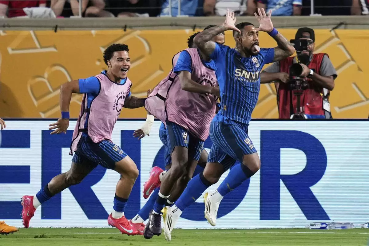 Al Hilal's Malcom, right, celebrates after scoring his team's second goal during the Club World Cup round of 16 soccer match between Manchester City and Al Hilal in Orlando, Fla., Monday, June 30, 2025. (AP Photo/John Raoux)