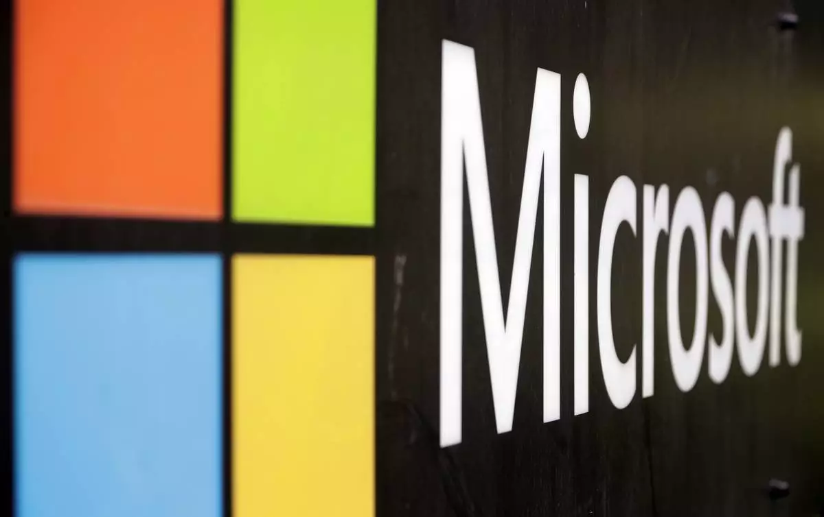 FILE - The Microsoft company logo is displayed at their offices in Sydney, Australia, on Feb. 3, 2021. (AP Photo/Rick Rycroft, File)