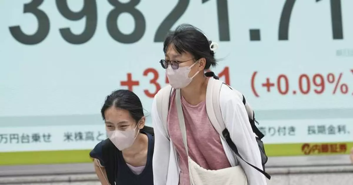 World shares are mostly down as Trump’s tariff deadline looms, while US stocks set records