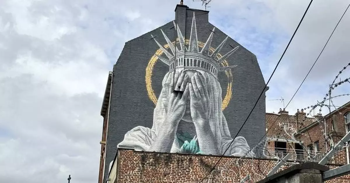 A new mural in France shows the Statue of Liberty covering her eyes in a swipe at Trump