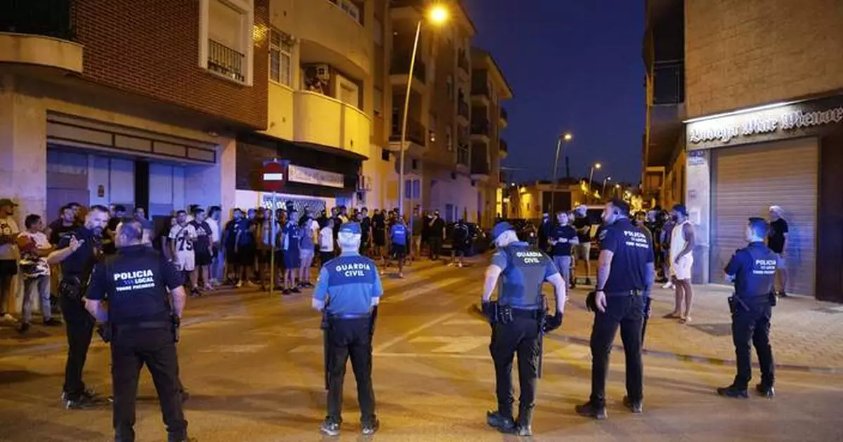 Police detain 8 people after anti-migrant clashes in Spanish town