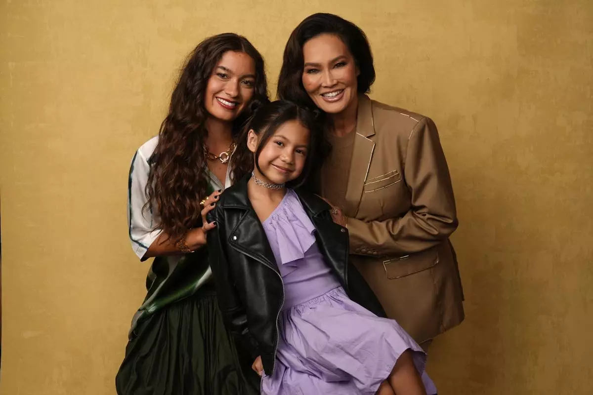 Sydney Agudong, from left, Maia Kealoha, and Tia Carrere pose for a portrait to promote "Lilo &amp; Stitch" during Comic-Con International on Friday, July 25, 2025, in San Diego. (AP Photo/Chris Pizzello)