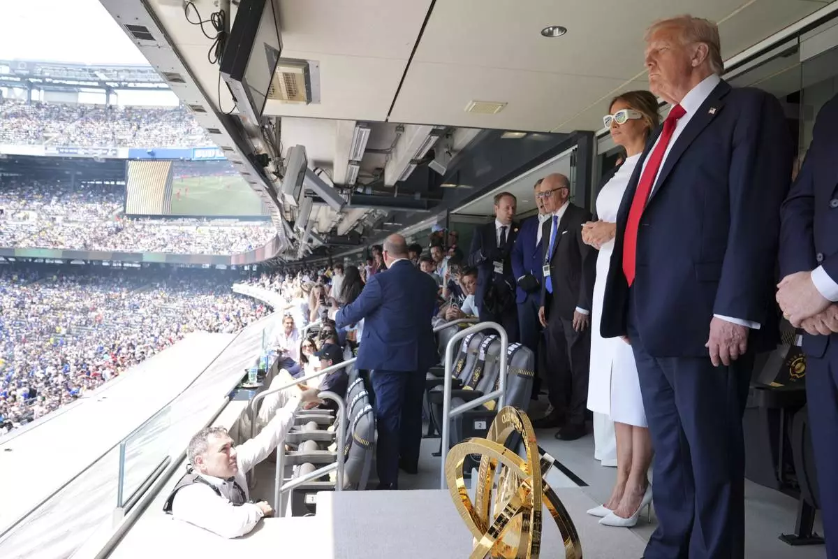 President Donald Trump, right, and first lady Melania Trump attend the Club World Cup final soccer match, at MetLife Stadium in East Rutherford, N.J., Sunday, July 13, 2025. (AP Photo/Jacquelyn Martin)