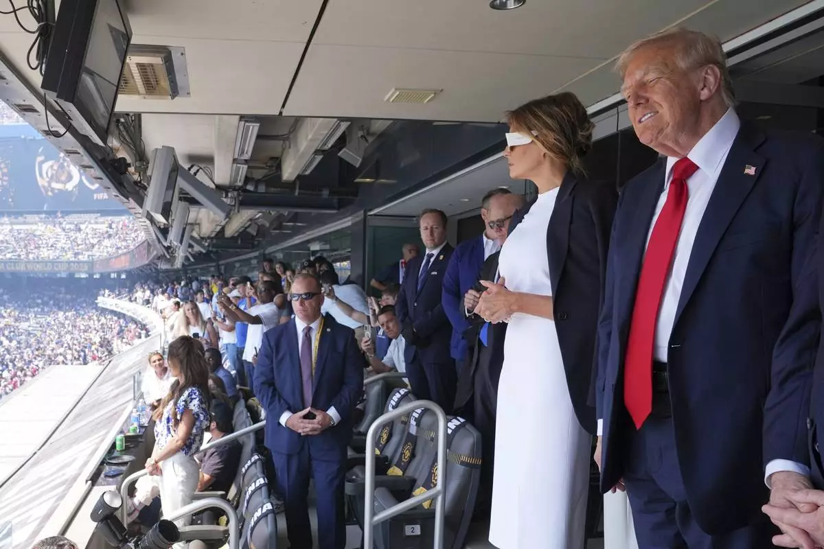 President Donald Trump, right, and first lady Melania Trump attend the Club World Cup final soccer match, at MetLife Stadium in East Rutherford, N.J., Sunday, July 13, 2025. (AP Photo/Jacquelyn Martin)