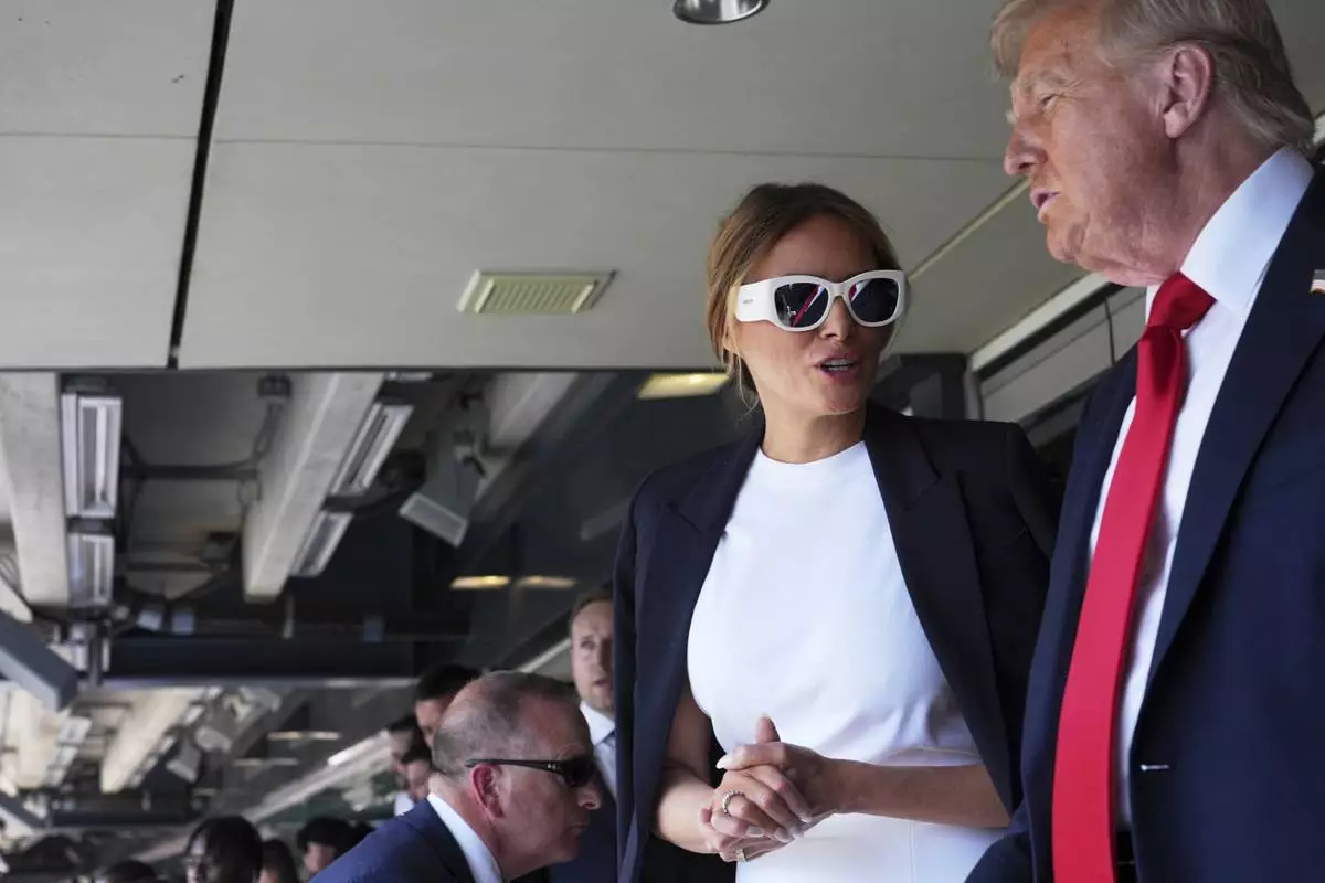 President Donald Trump, right, and first lady Melania Trump attend the Club World Cup final soccer match, at MetLife Stadium in East Rutherford, N.J., Sunday, July 13, 2025. (AP Photo/Jacquelyn Martin)