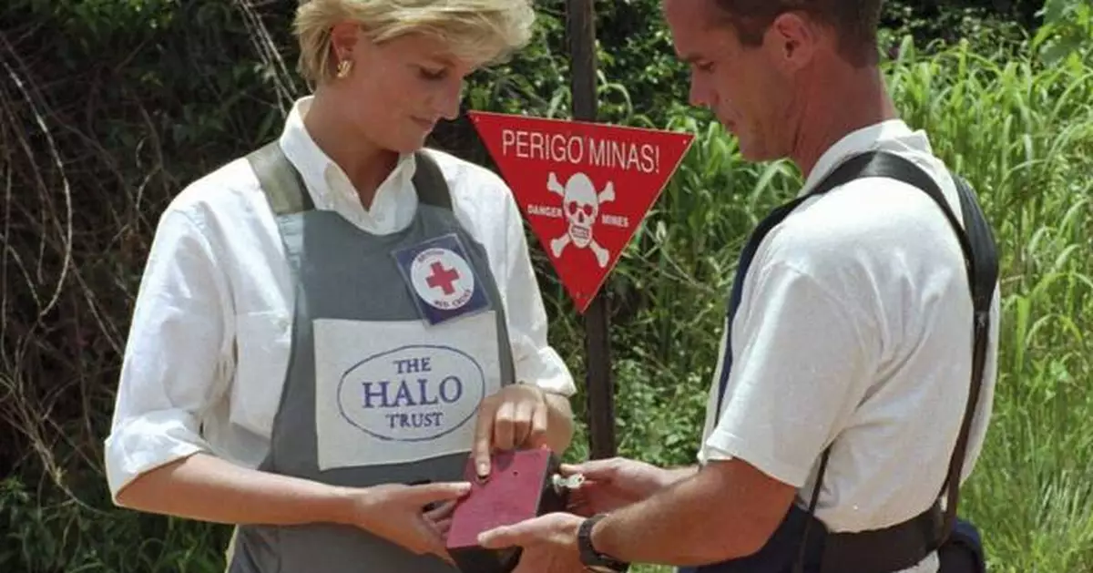 Prince Harry retraces Diana's footsteps by walking through a land mine field in Angola for charity