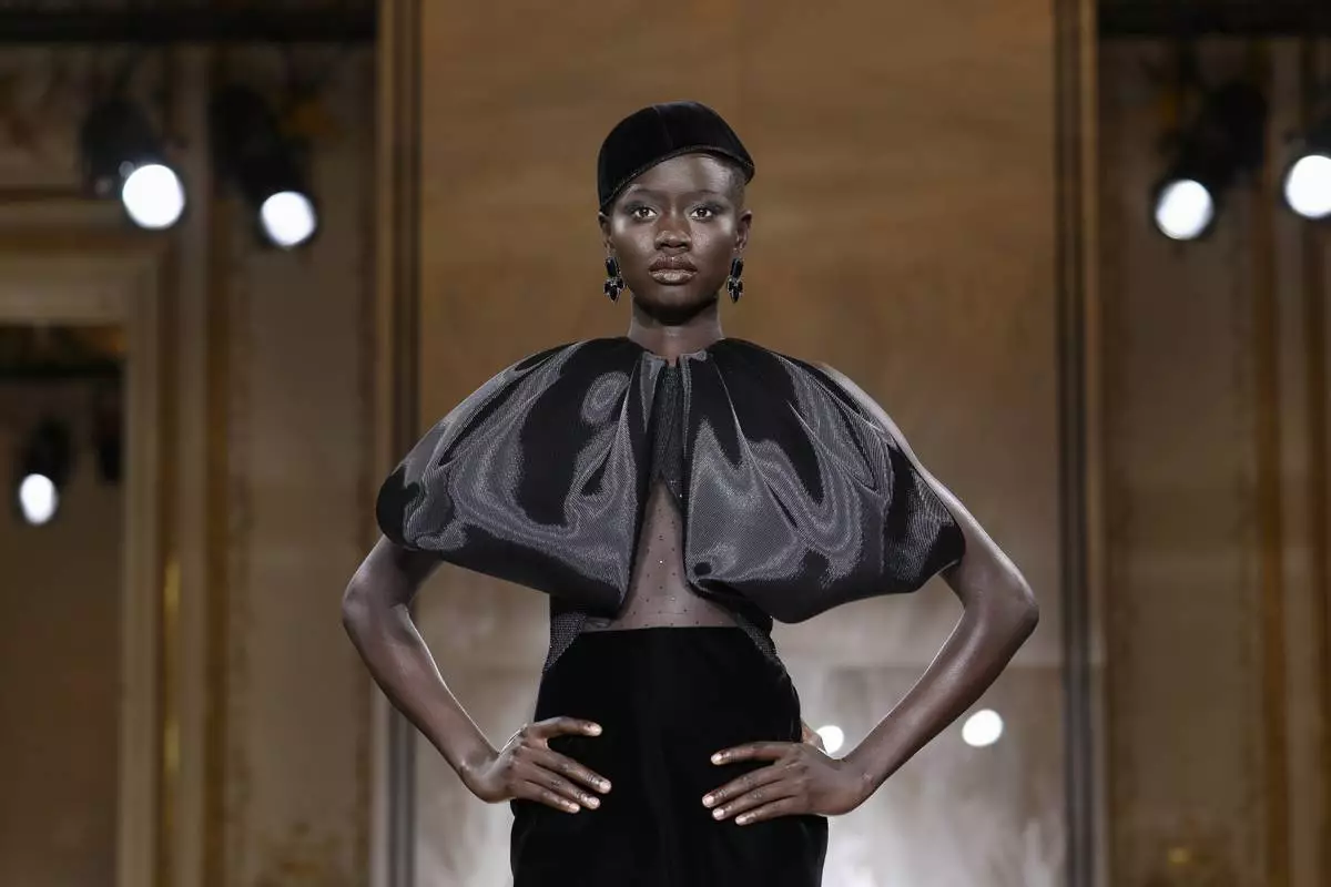 A model wears a creation as part of the Giorgio Armani Prive Fall-Winter 2025/26 Haute Couture collection presented Tuesday, July 8, 2025, in Paris. (AP Photo/Tom Nicholson)