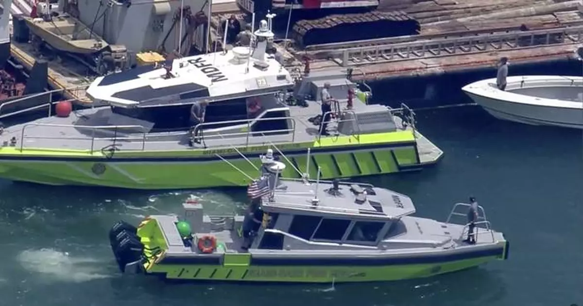 Coast Guard begins salvage operation and investigates cause of boat collision that killed two girls
