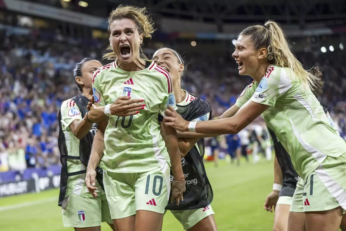 Italy's Cristiana Girelli (10) celebrates with teammates after scoring their second goal during the Women's Euro 2025 quarterfinals soccer match between Norway and Italy at Stade de Geneve in Geneva, Switzerland, Wednesday, July 16, 2025. (Martial Trezzini/Keystone via AP)