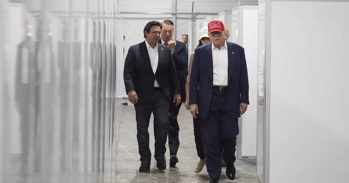 Photos of Trump touring an immigration detention center dubbed 'Alligator Alcatraz'