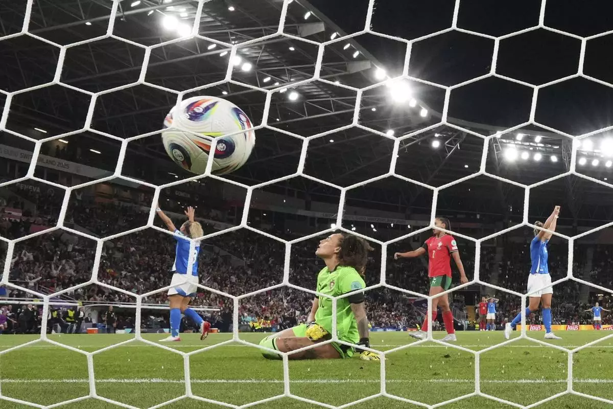 Portugal goalkeeper Patricia Morais reacts after Italy's Cristiana Girelli scored the opening goal during the Euro 2025, group B, soccer match between Portugal and Italy at Stade de Geneve in Geneva, Switzerland, Monday, July 7, 2025. (AP Photo/Alessandra Tarantino)