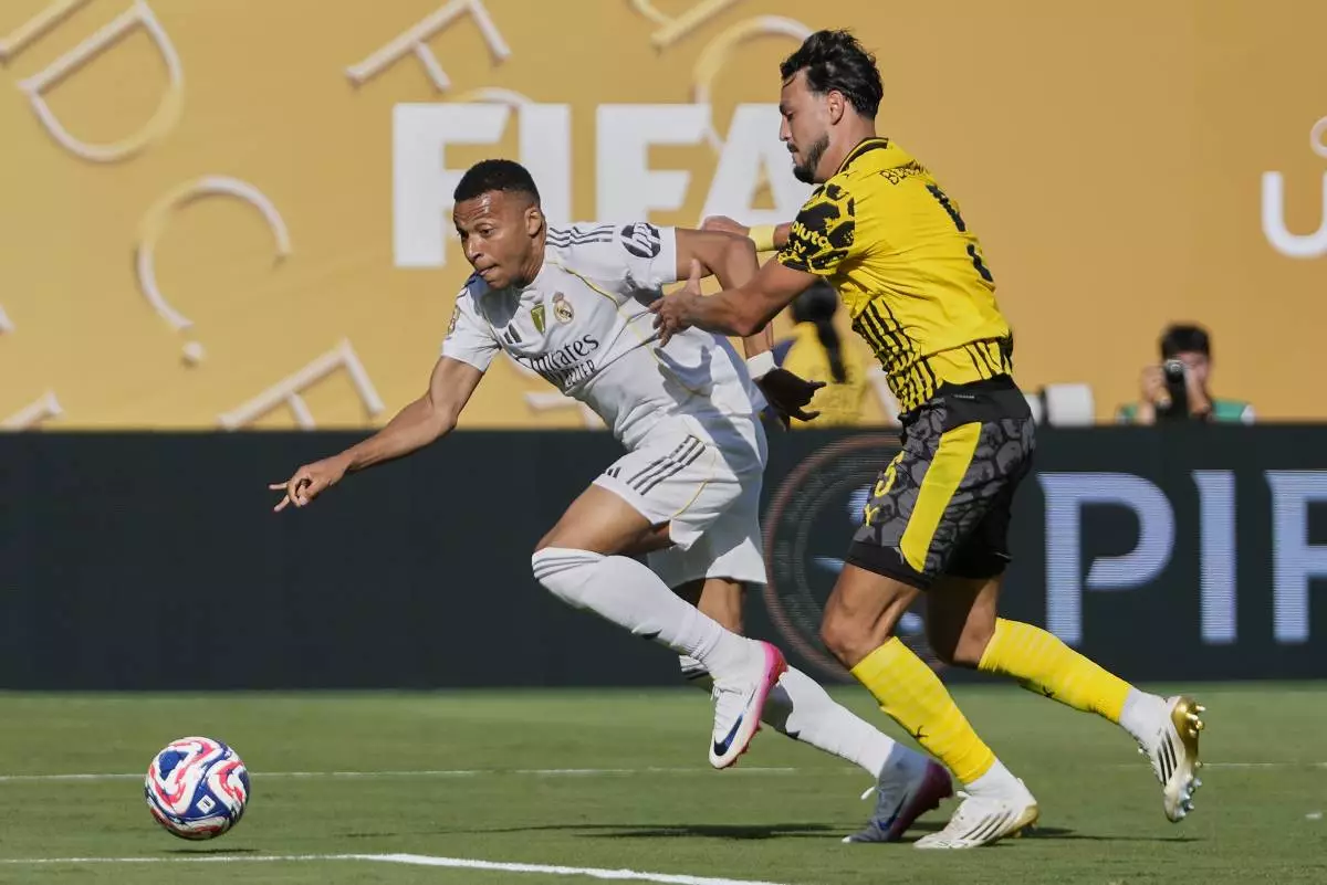 Real Madrid's Kylian Mbappe controls the ball against Borussia Dortmund's Ramy Bensebaini during the second half of a Club World Cup quarterfinal soccer match, Saturday, July 5, 2025 in East Rutherford, N.J. (AP Photo/Frank Franklin II)