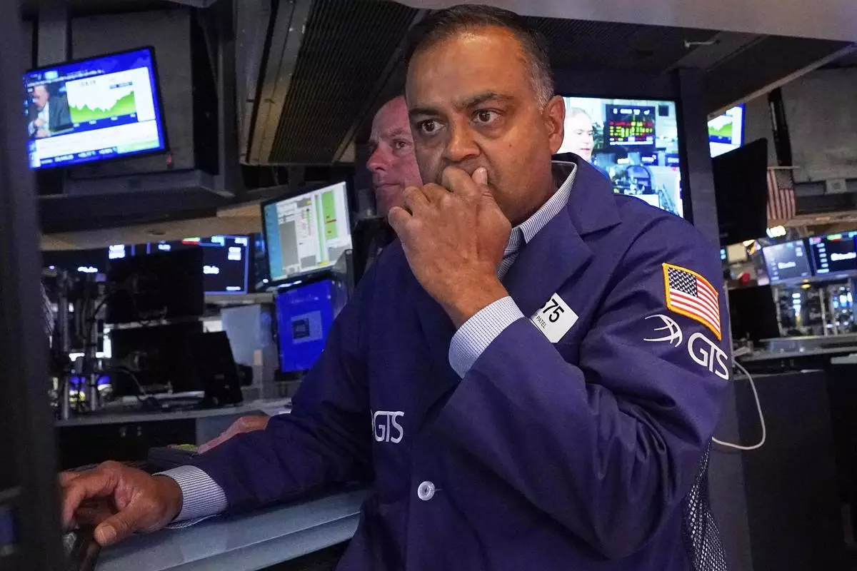 Specialist Dilip Patel works on the floor of the New York Stock Exchange, Tuesday, July 8, 2025. (AP Photo/Richard Drew)