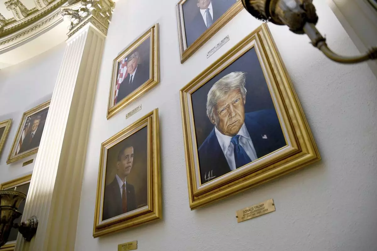Portraits of President Donald Trump and other presidents hang in the Colorado State Capitol in Denver on Tuesday, July 1, 2025. (AP Photo/Thomas Peipert)