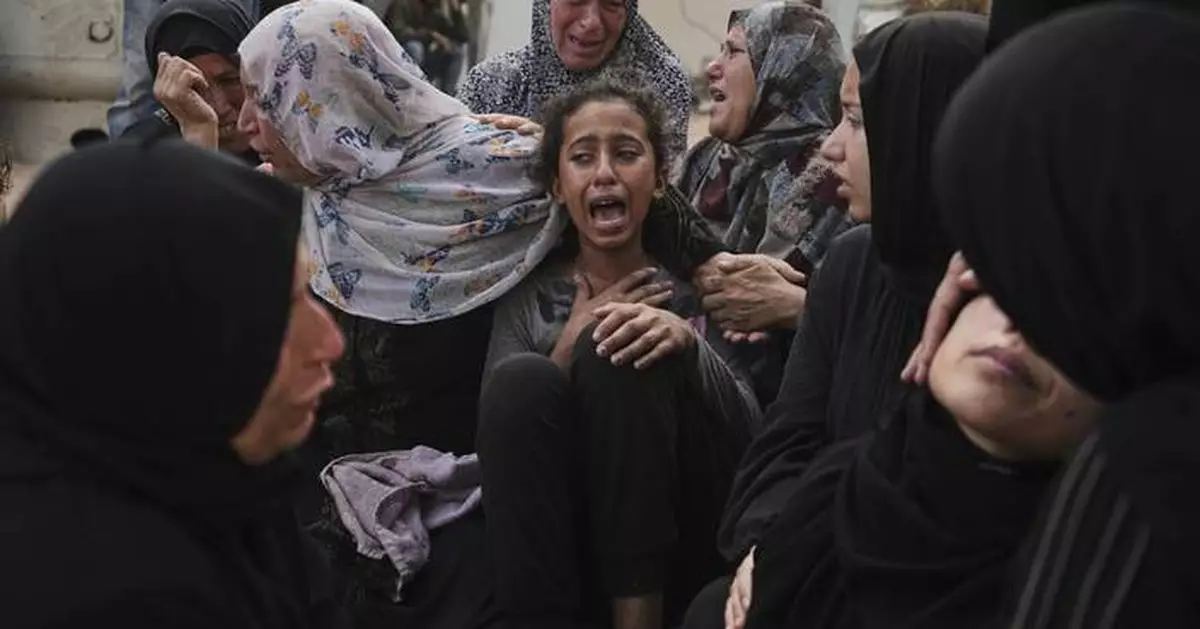 Photos show people mourning after airstrikes and shooting in Gaza overnight